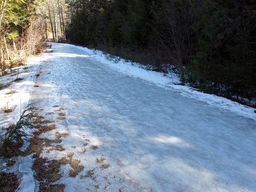 icy snowmobile trail in March at Northwood Meadows State Park in southern New Hampshire