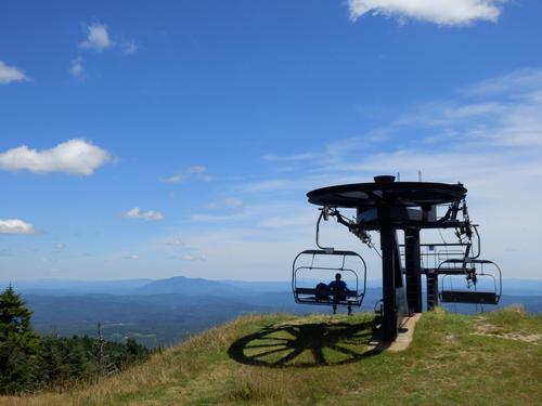 a hiker enjoys the view on Okemo (Ludlow) Mountain in Vermont