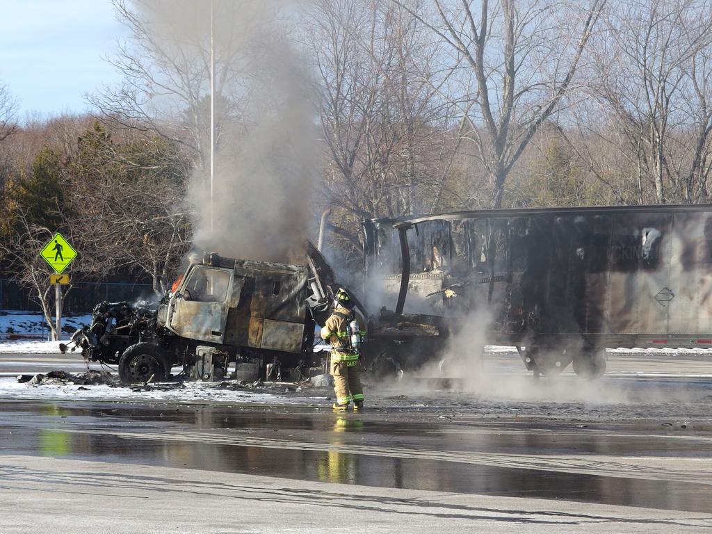 a trailer truck burns to toast in mid-winter at a rest area off the Maine Turnpike near the New Hampshire border