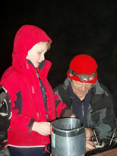 night hikers with a backpack stove on Pack Monadnock Mountain in New Hampshire