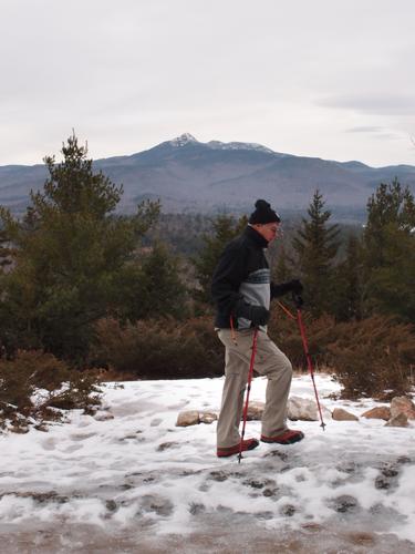 a hiker at the viewpoint on Page Hill in New Hampshire