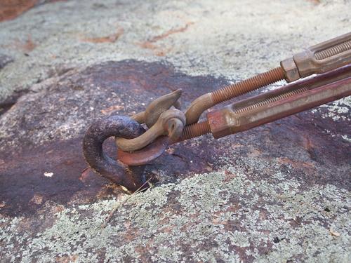 anchor bolt stabilizing the summit fire tower atop Pawtuckaway South Mountain in New Hampshire