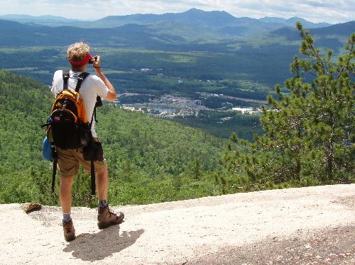 hiker and view from Peaked Mountain in New Hampshire
