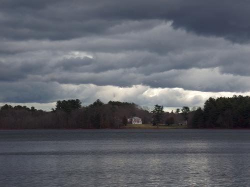 sinister view in December across Wenham Lake at Phillips Nature Preserve in northeastern Massachusetts