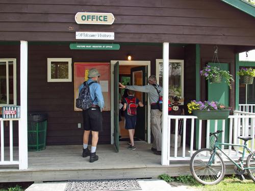 hikers checking in at the Camp Walt Whitman office to hike Piermont Mountain in western New Hampshire