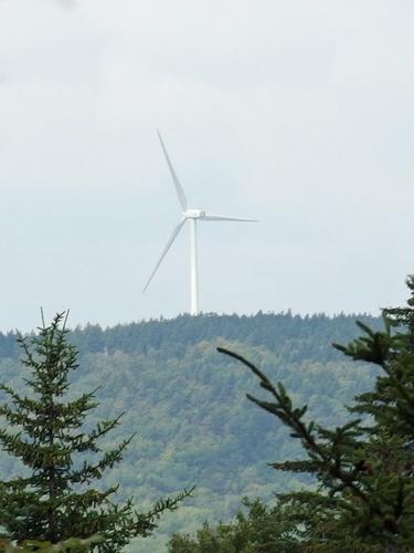 wind turbine as seen from the old fire-tower hill at Pillsbury State Park in New Hampshire