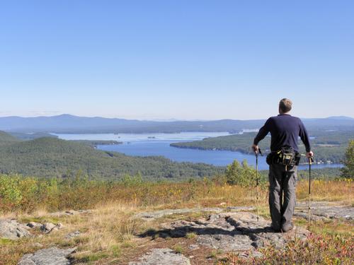 hiker at the summit of Pine Mountain in New Hampshire