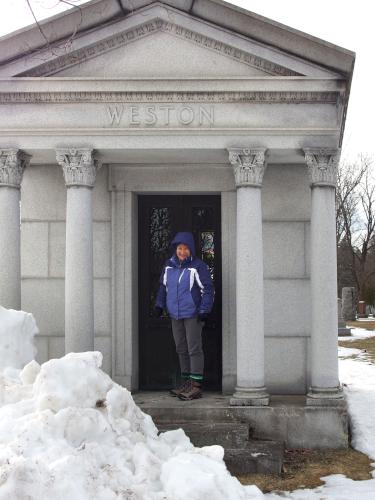 Andee in March in front of one of the mausoleums at Pine Grove Cemetery in Manchester, NH