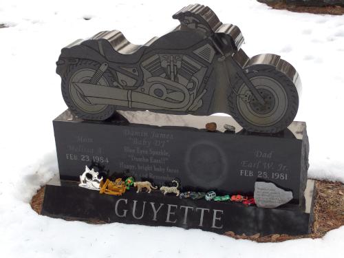 motorcycle gravestone in March at Pine Grove Cemetery in Manchester, NH