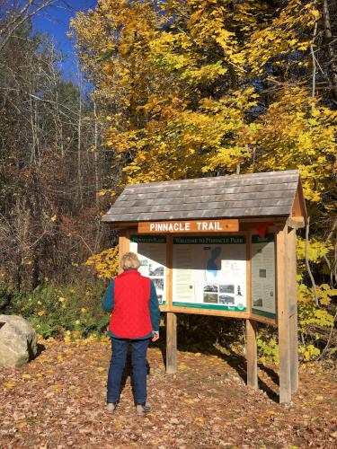 Andee at the trailhead kiosk for Hooksett Pinnacle in southern New Hampshire