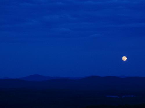 moonrise as seen from the fire tower on Pitcher Mountain in southern New Hampshire