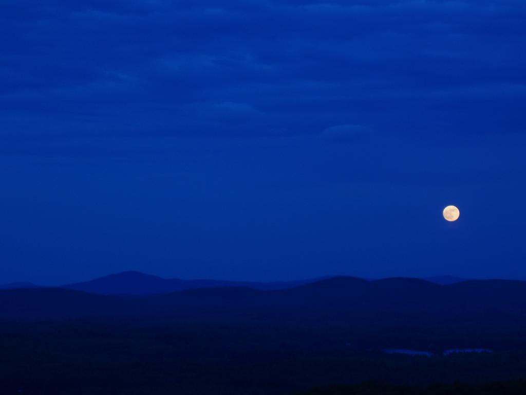 moonrise as seen from the fire tower on Pitcher Mountain in southern New Hampshire