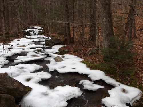 pre-winter icy brook beside the trail to Plymouth Mountain in New Hampshire