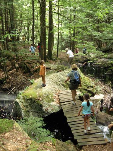 hikers at Pulpit Rock Conservation Area in New Hampshire