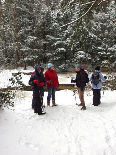 winter hikers at Purgatory Falls Brook Preserve in southern New Hampshire