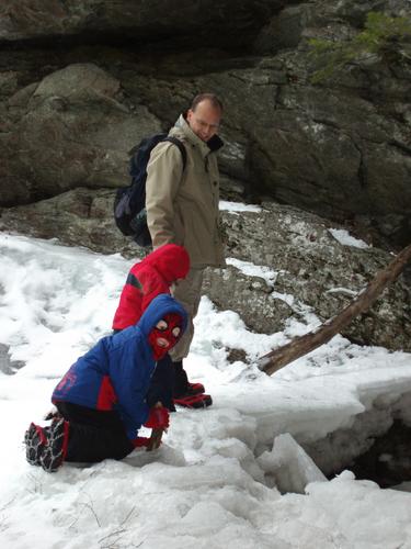 winter hikers at Purgatory Falls in New Hampshire
