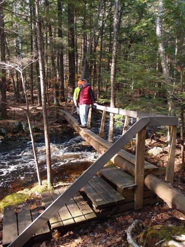 the upper bridge in Purgatory Falls Brook Preserve in New Hampshire