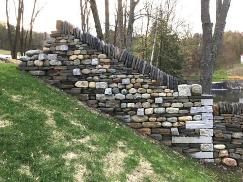 practice stone wall constructed at The Stone Trust at Dummerston near Putney Mountain in southern Vermont
