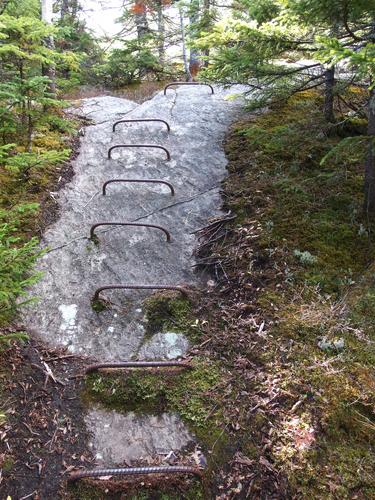 metal ladder rungs on a steep section of the Grafton Loop trail to Puzzle Mountain in western Maine