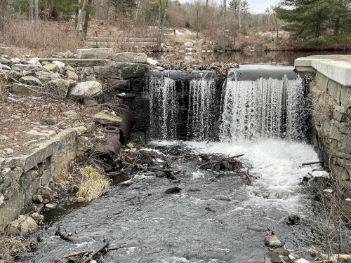 falls in February where Cow Pond Brook flows into Massapoag Pond near Red Line Path at Westford in northeast MA