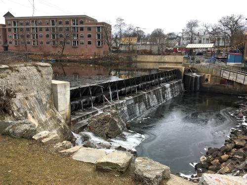 the no-flow falls in December near Margaritas Restaurant as seen from the Nashua Riverwalk in New Hampshire