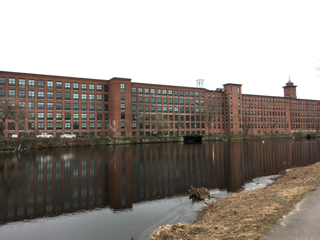 historic mill buildings (now condominiums) in December at Nashua Riverwalk in New Hampshire