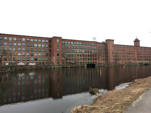 historic mill buildings (now condominiums) in December at Nashua Riverwalk in New Hampshire