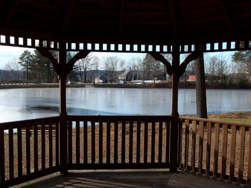 view from inside the gazebo across the reservoir in December at Robin Hood Park at Keene in southwest New Hampshire