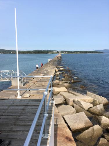looking back from the lighthouse toward shore on Rockland Breakwater in Maine