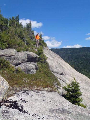 walking the cliff edge at Sachem Peak in New Hampshire