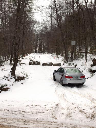 car parked at the road gate at Saddle Hill in New Hampshire