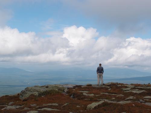 Len takes in the dramatic panorama from atop The Horn on Saddleback Mountain in Maine