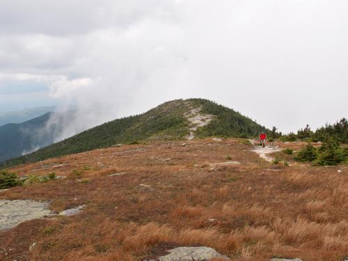 hiker on the Appalachian Trail to Saddleback Mountain in Maine