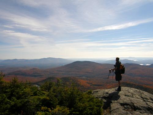 Tom stands out on a ledge in October near Sandwich Dome in New Hampshire