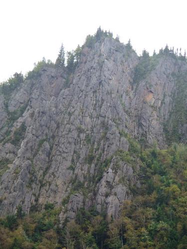 cliffs at Dixville Notch as seen from the trail to Sanguinary Mountain in New Hampshire