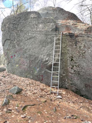 boulder in February at Sassafras Trail near Westford in northeast MA