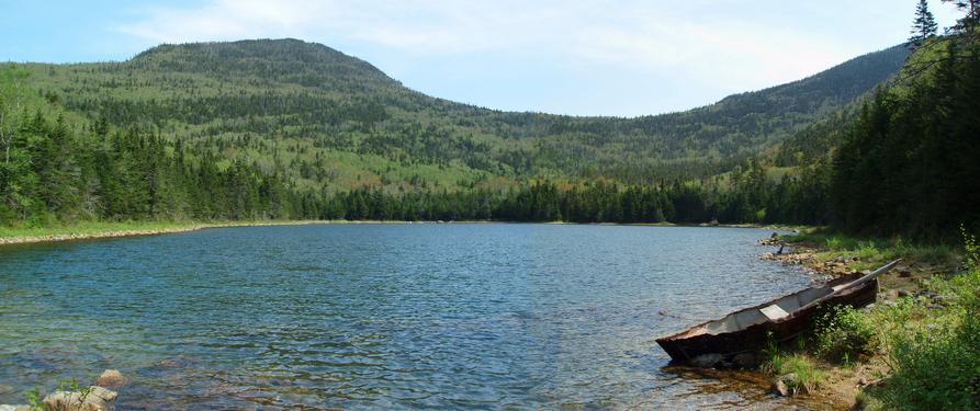 panoramic view of East Pond in May on the way to East Scar Ridge in the White Mountains of New Hampshire