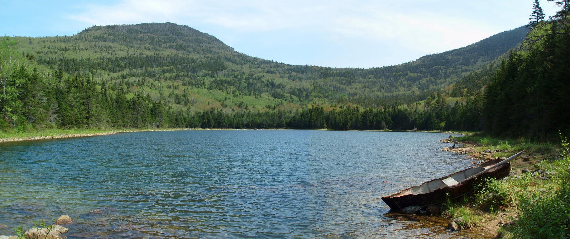 panoramic view of East Pond in May on the way to East Scar Ridge in the White Mountains of New Hampshire