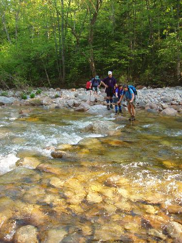 hikers crossing Hancock Branch on the way to West Scar Ridge in New Hampshire