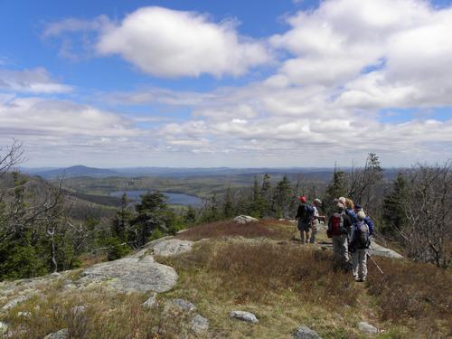 hikers in May on the way down from Mount Shaw in New Hampshire