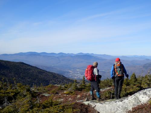 hikers and view from Shelburne Moriah Mountain in New Hampshire