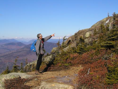 hiker near the summit of First Sister Mountain in New Hampshire