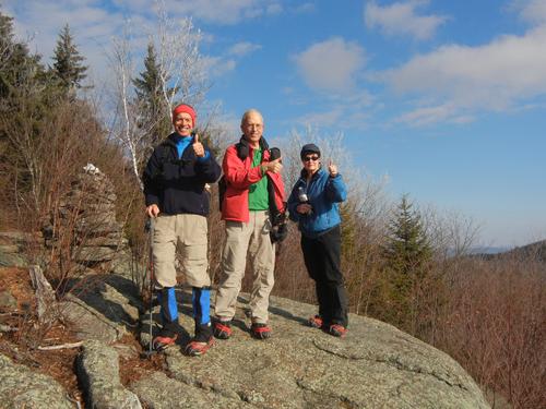 winter hikers atop Thumb Mountain in New Hampshire