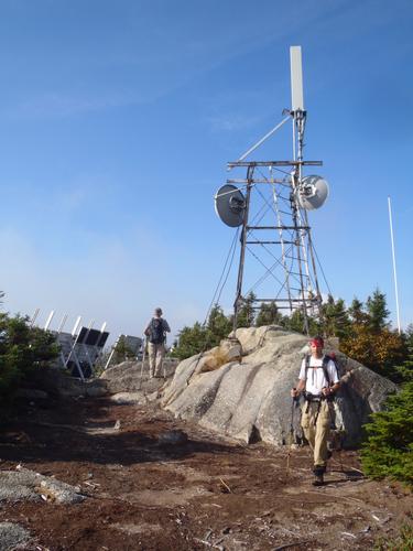 hikers at the tower on top of Big Spencer Mountain in Maine