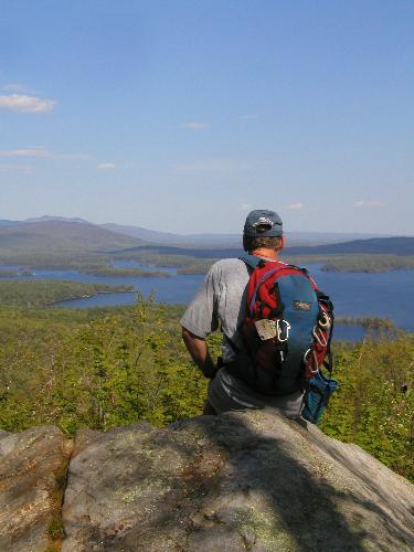hiker and view from Cotton Mountain in New Hampshire