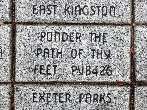 a hiker quote from the Bible (Proverbs 4:26) on a commemorative brick along the pedestrian walkway between Swazey Parkway and Squamscott River at Exeter in southern New Hampshire
