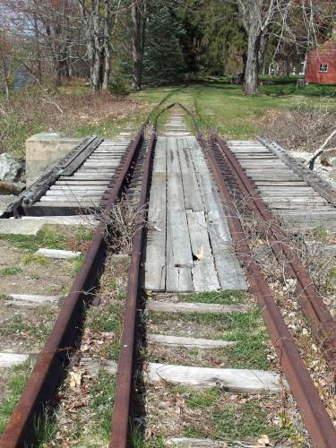 old railroad tracks in April at Squannacook Rail Trail North in northeast Massachusetts