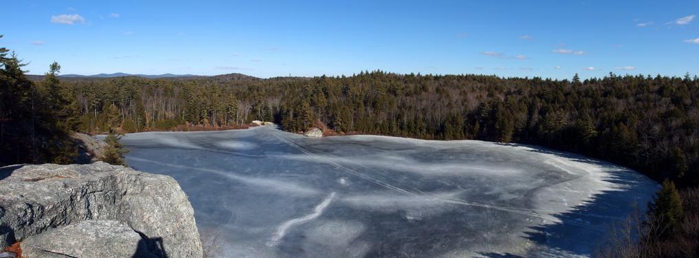 panoramic view from the famous cliff overlooking Stonehouse Pond in southeastern New Hampshire