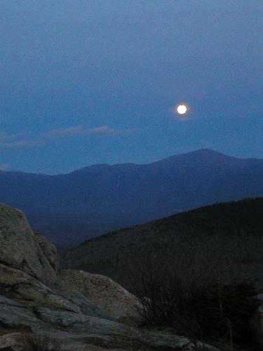 moonrise in November over Mount Washington as seen from Middle Sugarloaf Mountain in New Hampshire