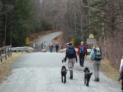 hikers starting up the access road toward Middle Sugarloaf Mountain in New Hampshire